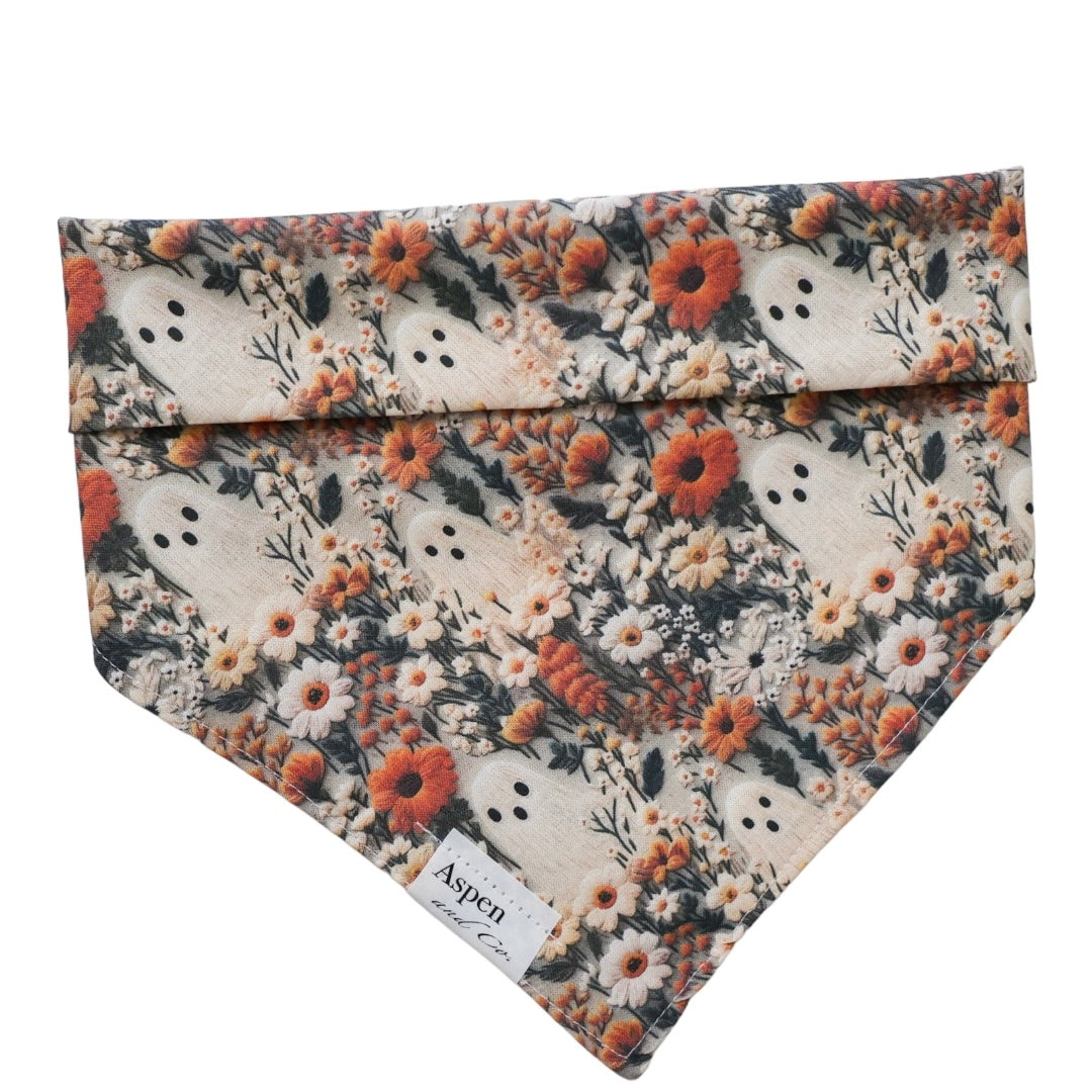 Ghostie dog bandana front side featuring autumn neutral colors, delicate foliage and floral patterns with small playful ghost designs, perfect fall-themed pet accessory