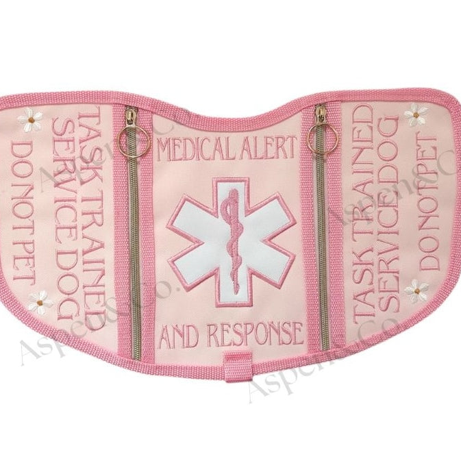 pink floral service dog vest with gold zippers, and dual side pockets. Embroidered floral design. Custom-fitted with straps and durable wipeable backing. Limited edition design from Aspen & Co.