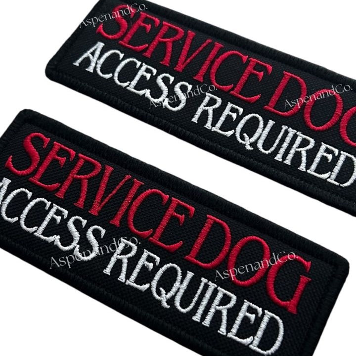 Two black patches with 'Service Dog Access Required' text in red and white on a white background.