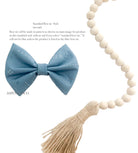 Blue classic dog collar bow tie with elastic straps shown flat