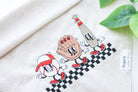 Linen dog bandana with embroidered smiley baseball, glove, and bat wearing a cap – sporty design perfect for baseball-loving pups.