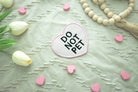 Pink heart patch with bold black 'DO NOT PET' lettering and matching embroidered edge, water-resistant design