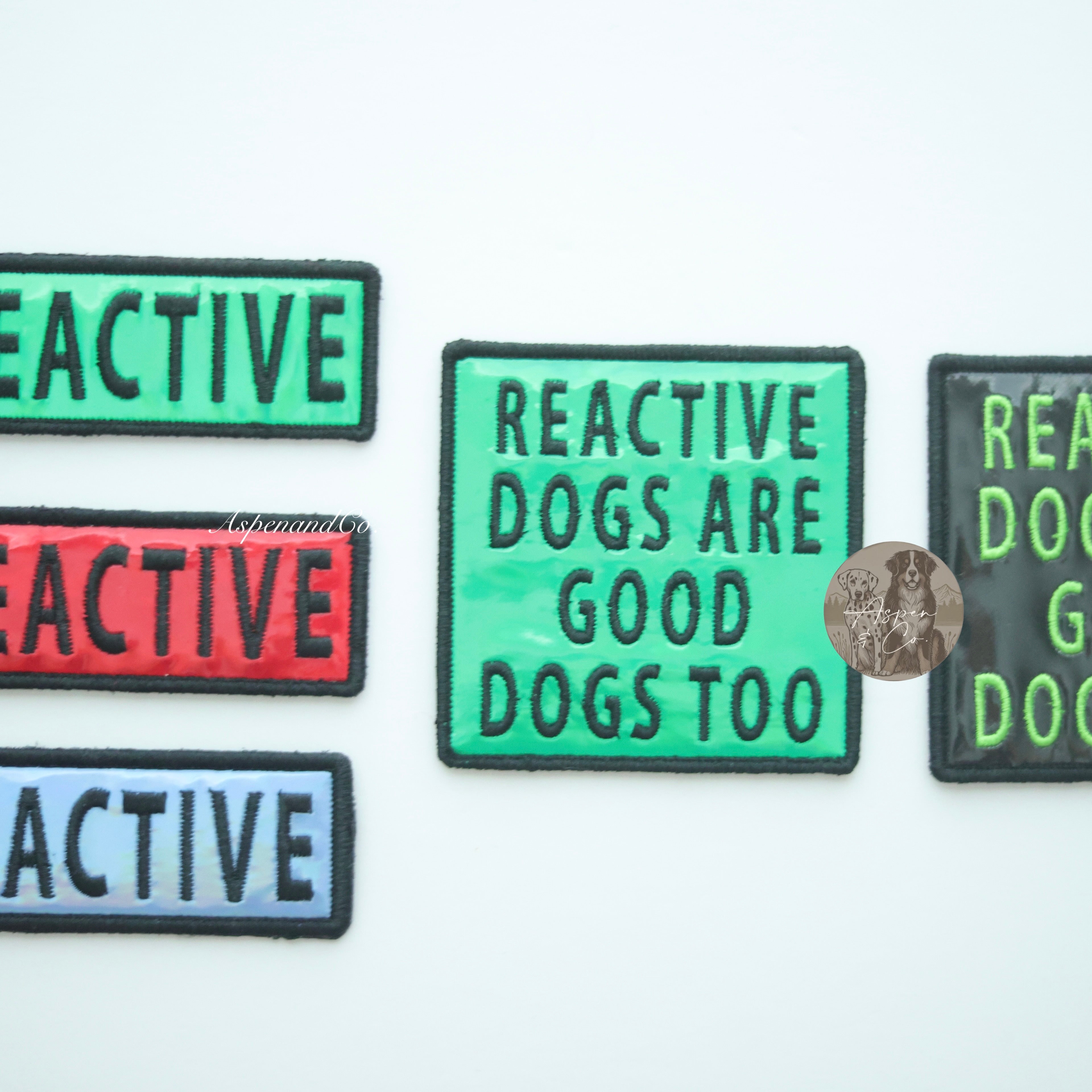 Photo showing available color options for holographic reactive dog patches: blue, green, red, and black.