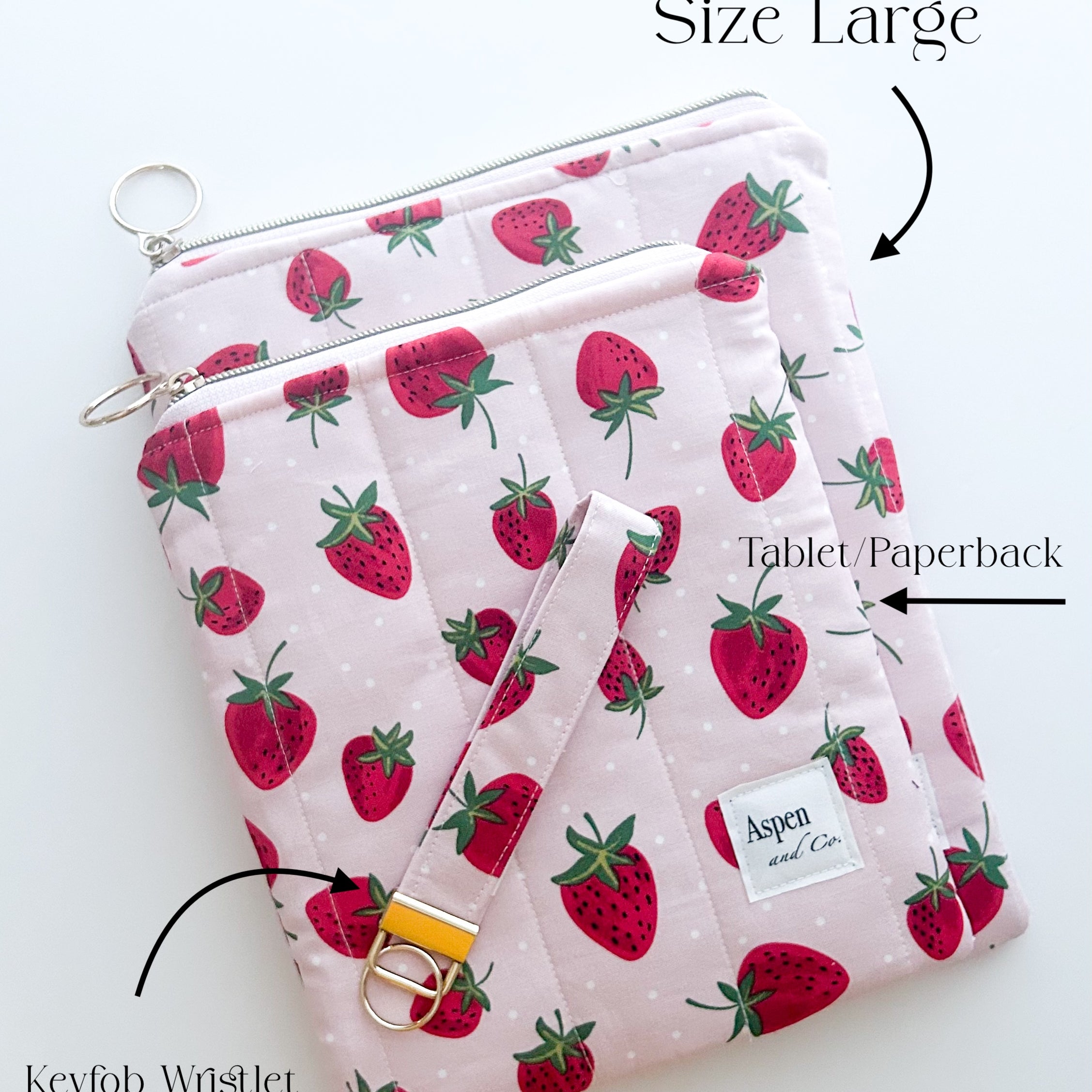 Handmade strawberry quilted book sleeve with zipper, pink fabric pouch for e-readers, hardcovers paperbacks- shows difference sizes on top of one another