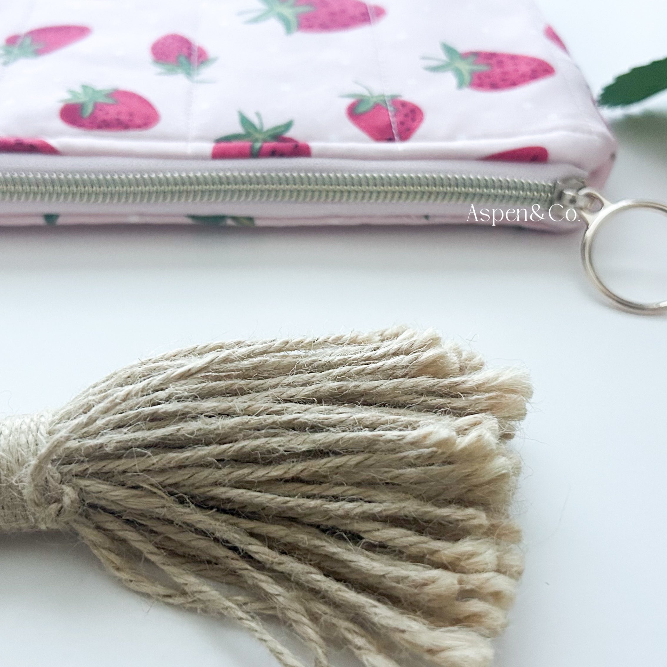 Handmade strawberry quilted book sleeve with zipper, pink fabric pouch for e-readers, hardcovers paperbacks - close up of gold zipper