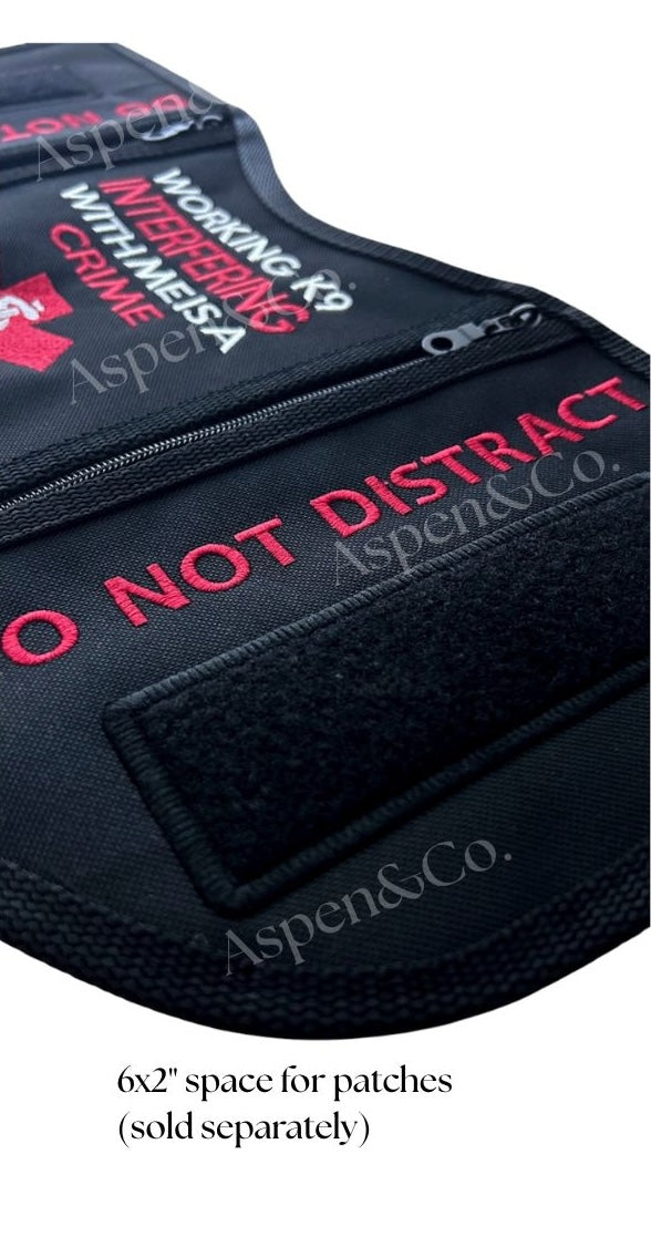 Close-up angle of the Aspen & Co. Working K9 vest showing the detailed embroidery and a 6x2" hook and loop patch panel labeled as space for optional add-on patches. Highlights high-stitch quality and reinforced zipper seams.