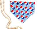 Blue dog bandana with red, white, and blue popsicle print.
