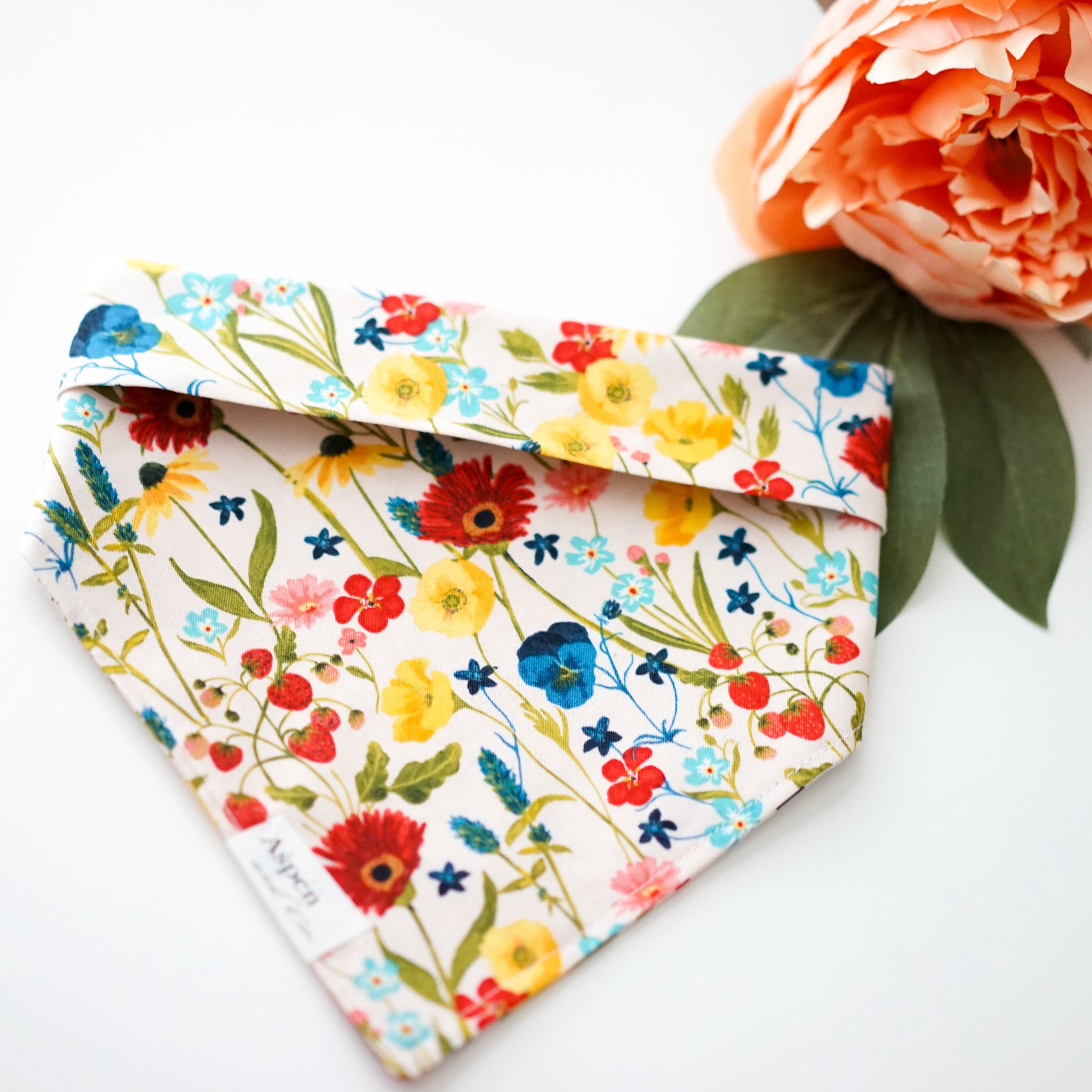 Wildflowers dog bandana by Aspen and Co. Handmade in Southern California featuring beautiful assorted wildflowers, this is a snap on dog bandana.Aspen and Co. offers dog bandanas, puppy bandanas,  dog portraits, dog mom shirts, waterproof bandanas, dog collars, dog birthday bandanas, and more.