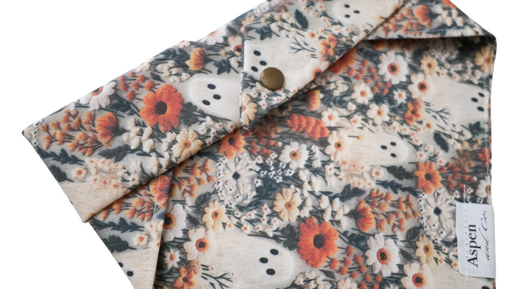 Close-up of snaps on the back of the Ghostie dog bandana for secure and adjustable fit.