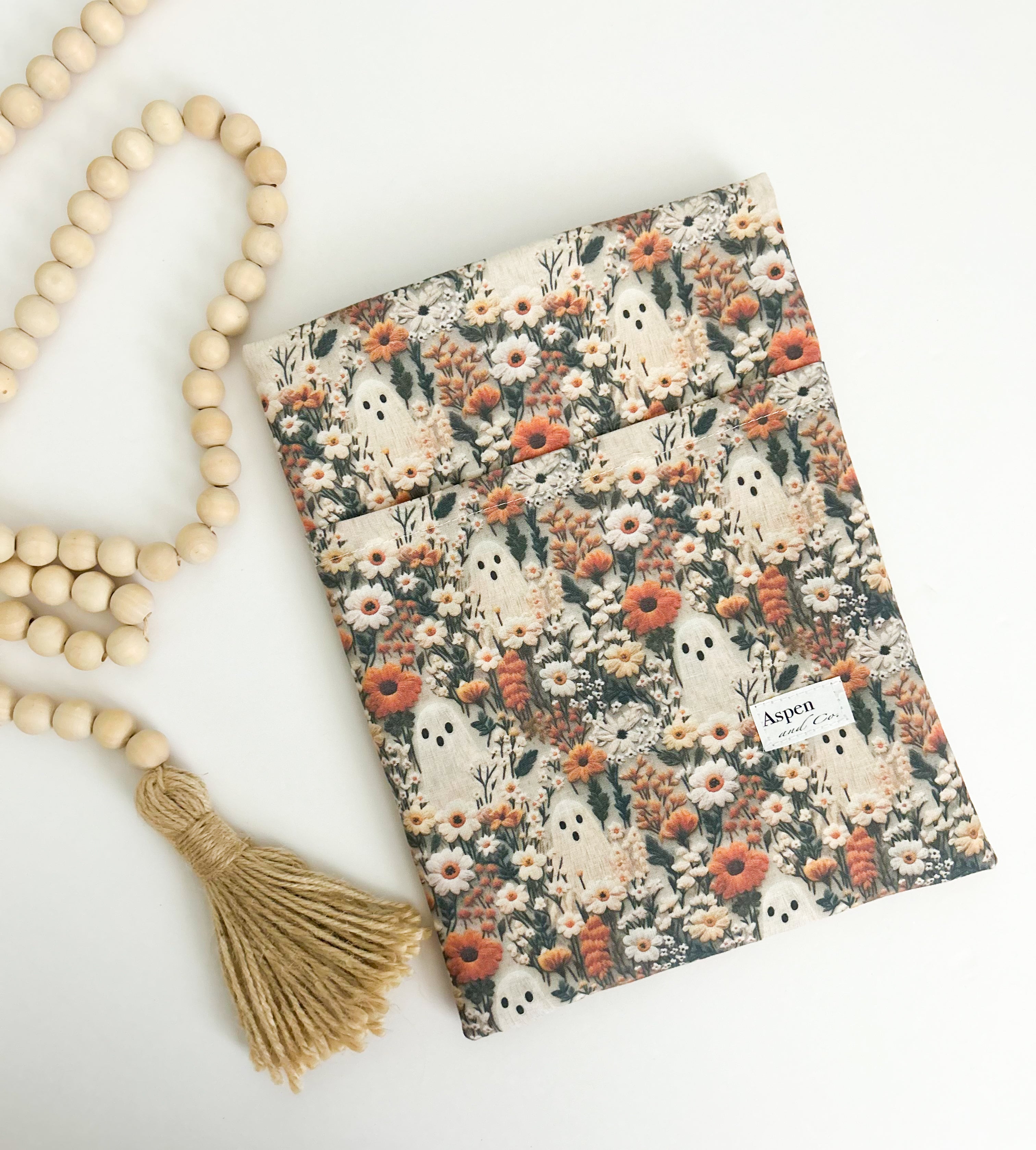 Front view of Ghostie book sleeve with ghost prin