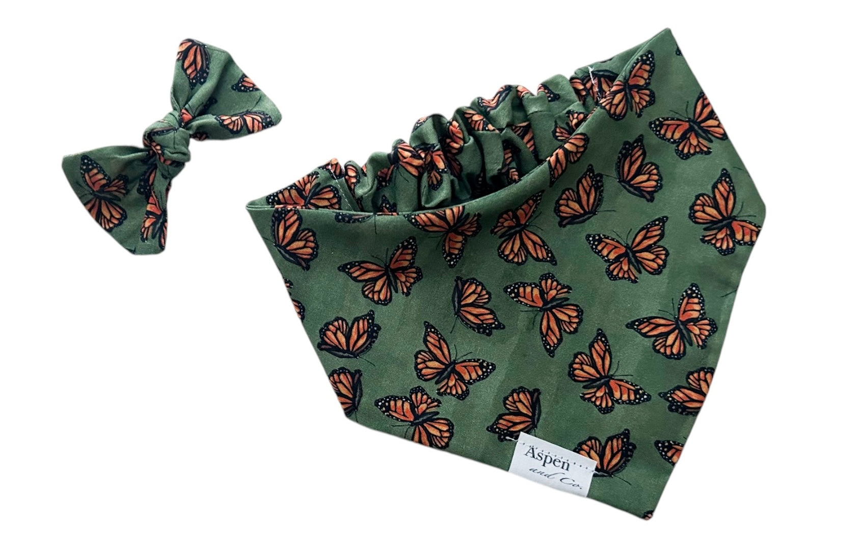 iew of olive monarch butterfly scrunchie slide-on dog bandana and matching bow, highlighting elastic scrunchie colla