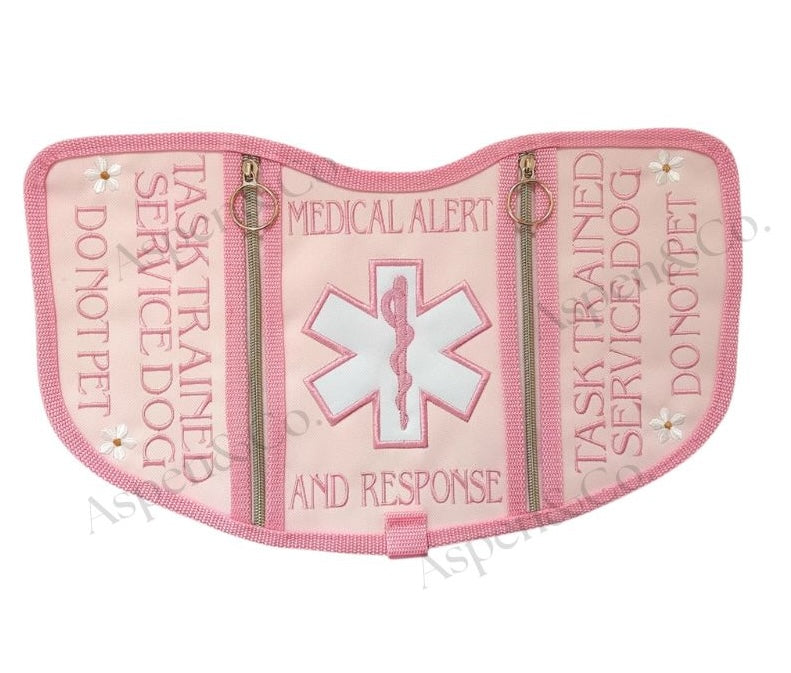 pink floral service dog vest with gold zippers, and dual side pockets. Embroidered floral design. Custom-fitted with straps and durable wipeable backing. Limited edition design from Aspen & Co.