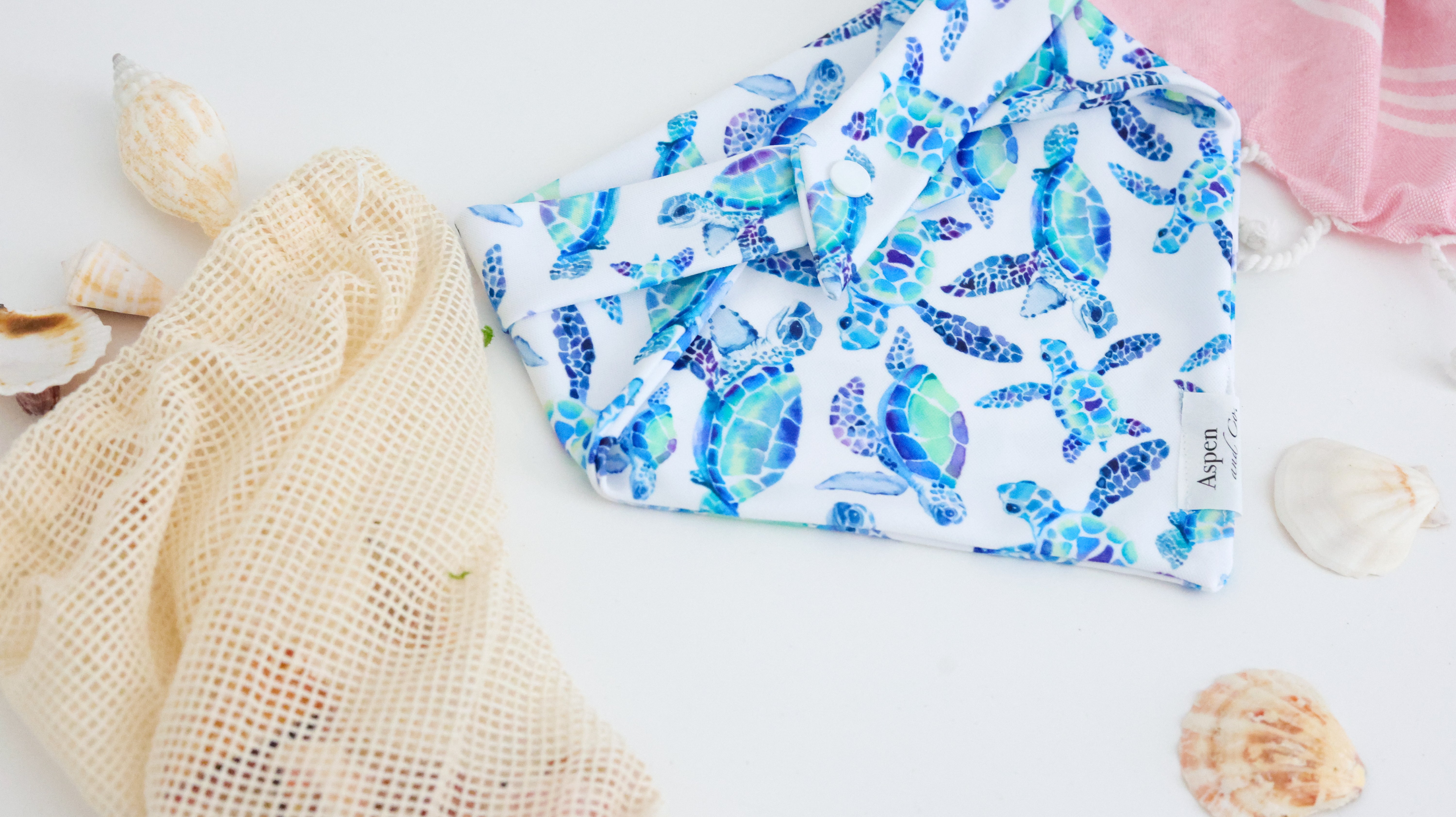 Back of sea turtle dog bandana showing secure snap closure and lightweight weatherproof fabric