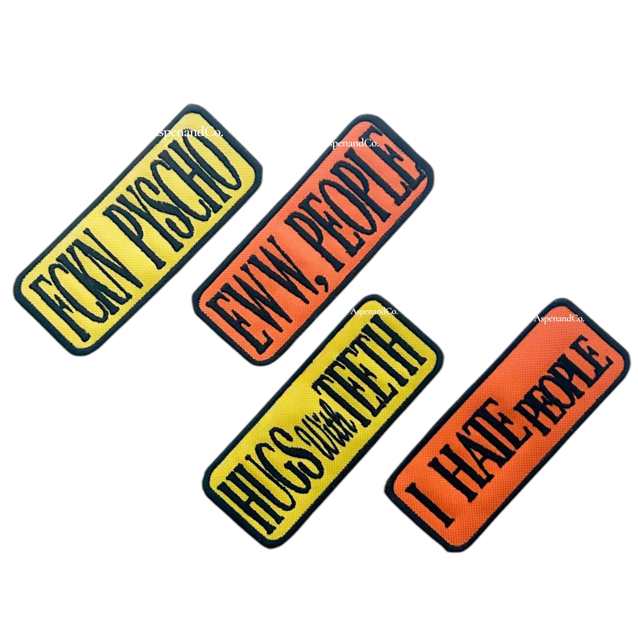 set of embroidered dog patches with bold phrases "FCKN PYSCHO," "EWW PEOPLE," "HUGS WITH TEETH," and "I HATE PEOPLE," in yellow and orange with black borders. Designed for dog vests or harnesses.