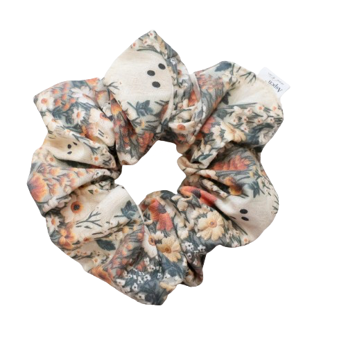 Ghostie-themed human scrunchie in autumn colors with little ghost and floral patterns, featuring elastic band for a comfortable fit.