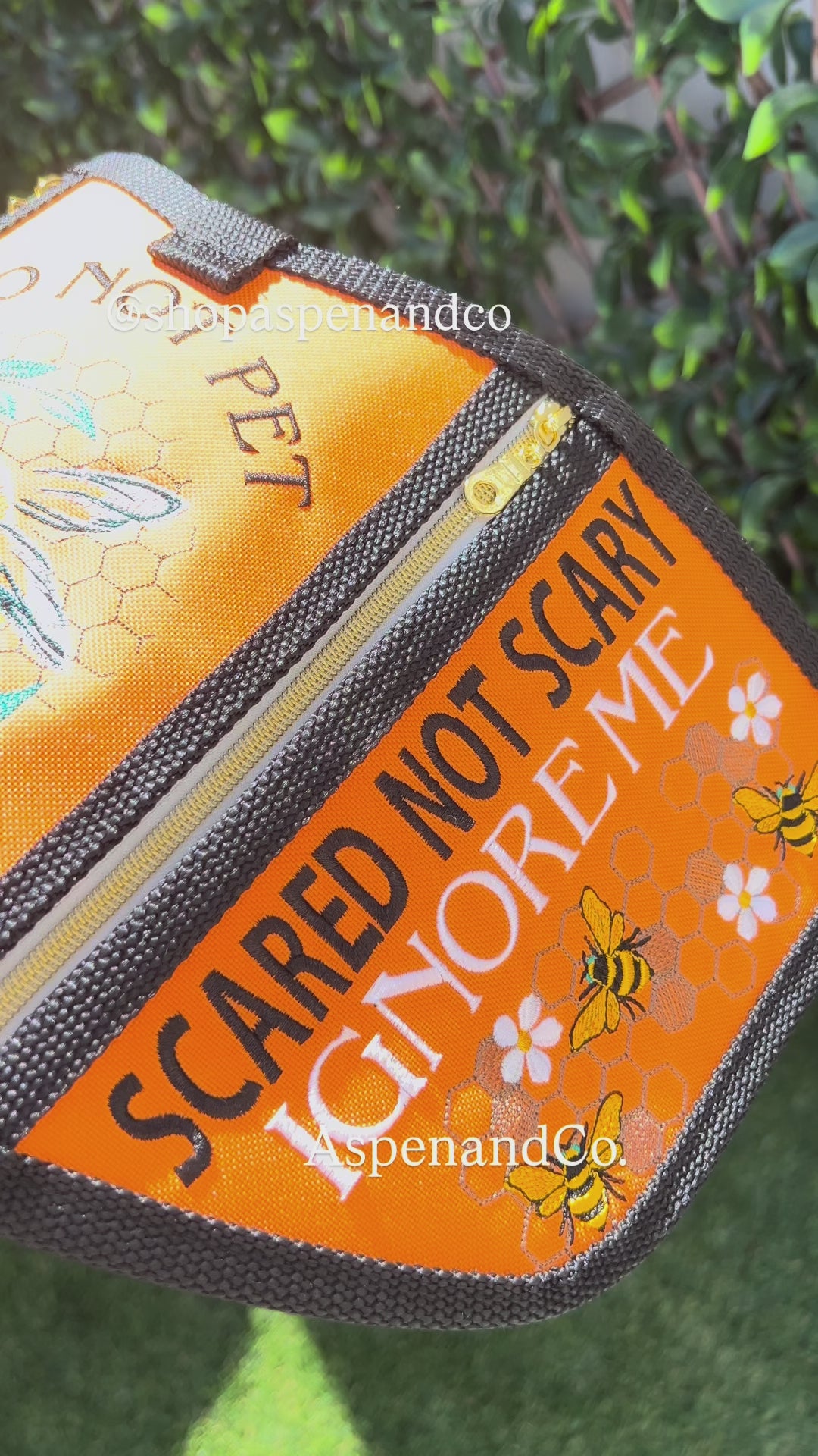 Video of reactive embroidered dog vest with zippered pockets and beautiful bee elements