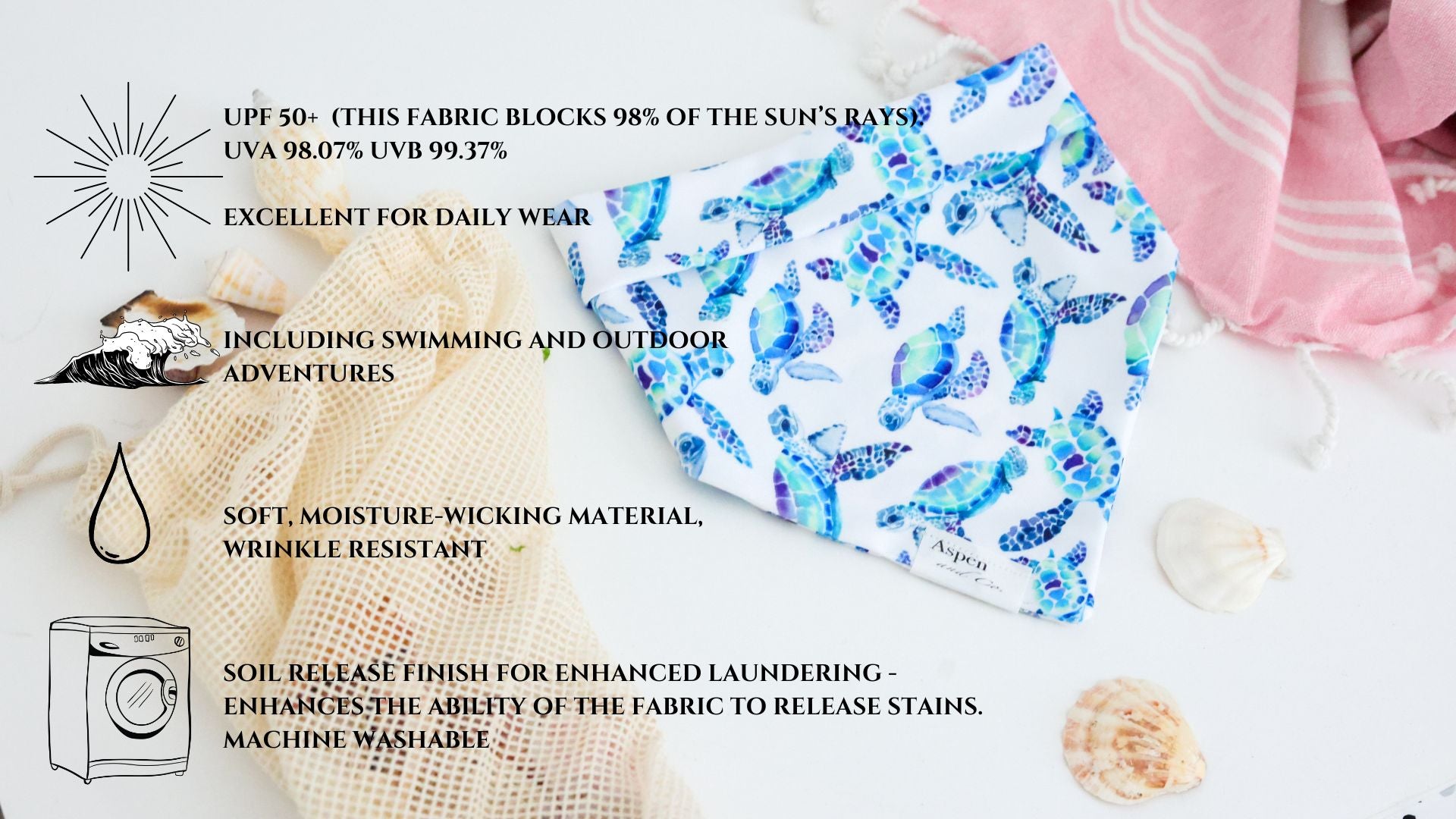 White weatherproof dog bandana with blue and turquoise sea turtles, Aspen and Co. tag, styled with seashells and a beach towel. The listing has the high points of the bandana type.