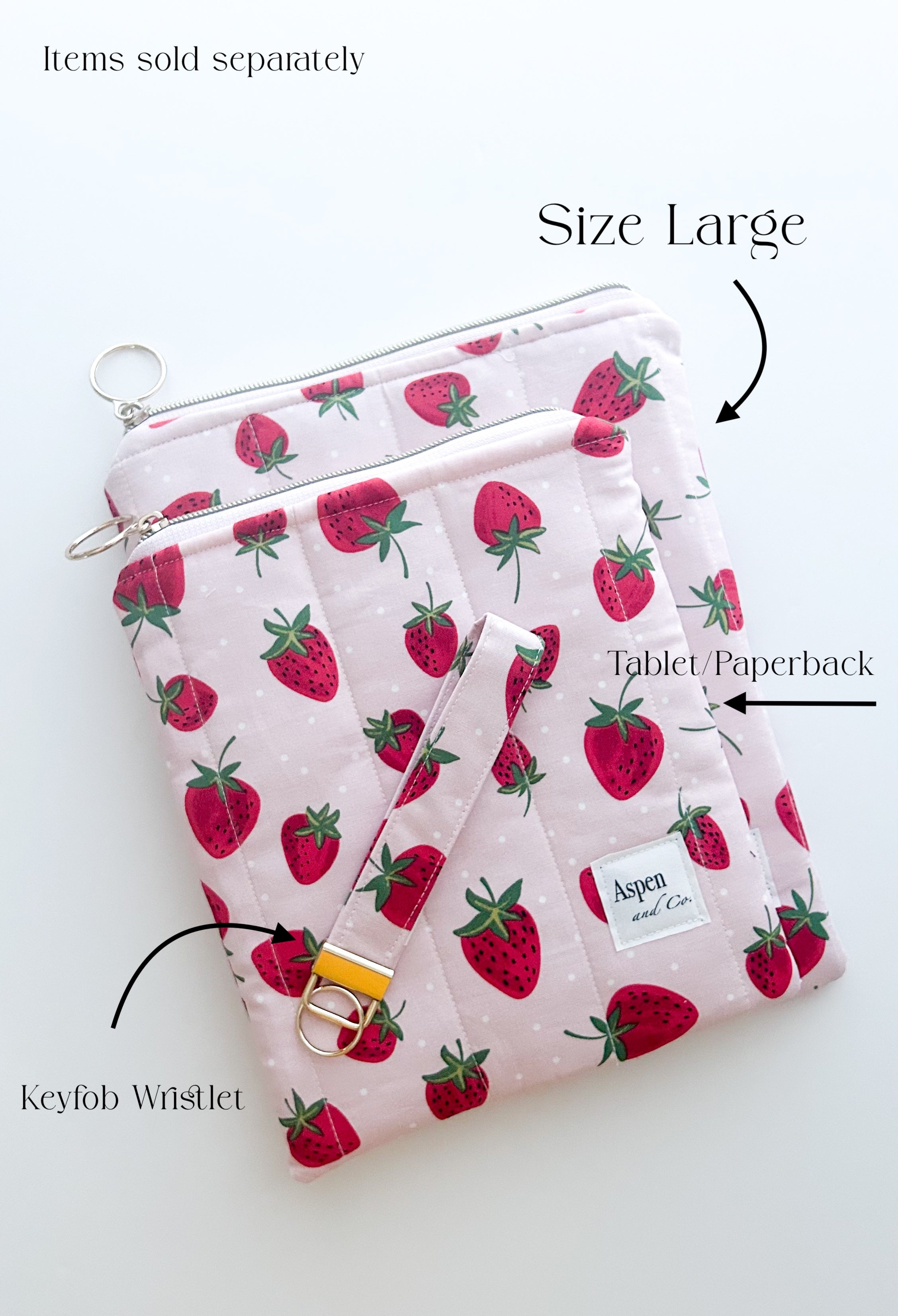 Handmade strawberry quilted book sleeve with zipper, pink fabric pouch for e-readers, hardcovers paperbacks- shows difference sizes on top of one another