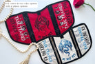 Red and ivory service dog vests with dragons